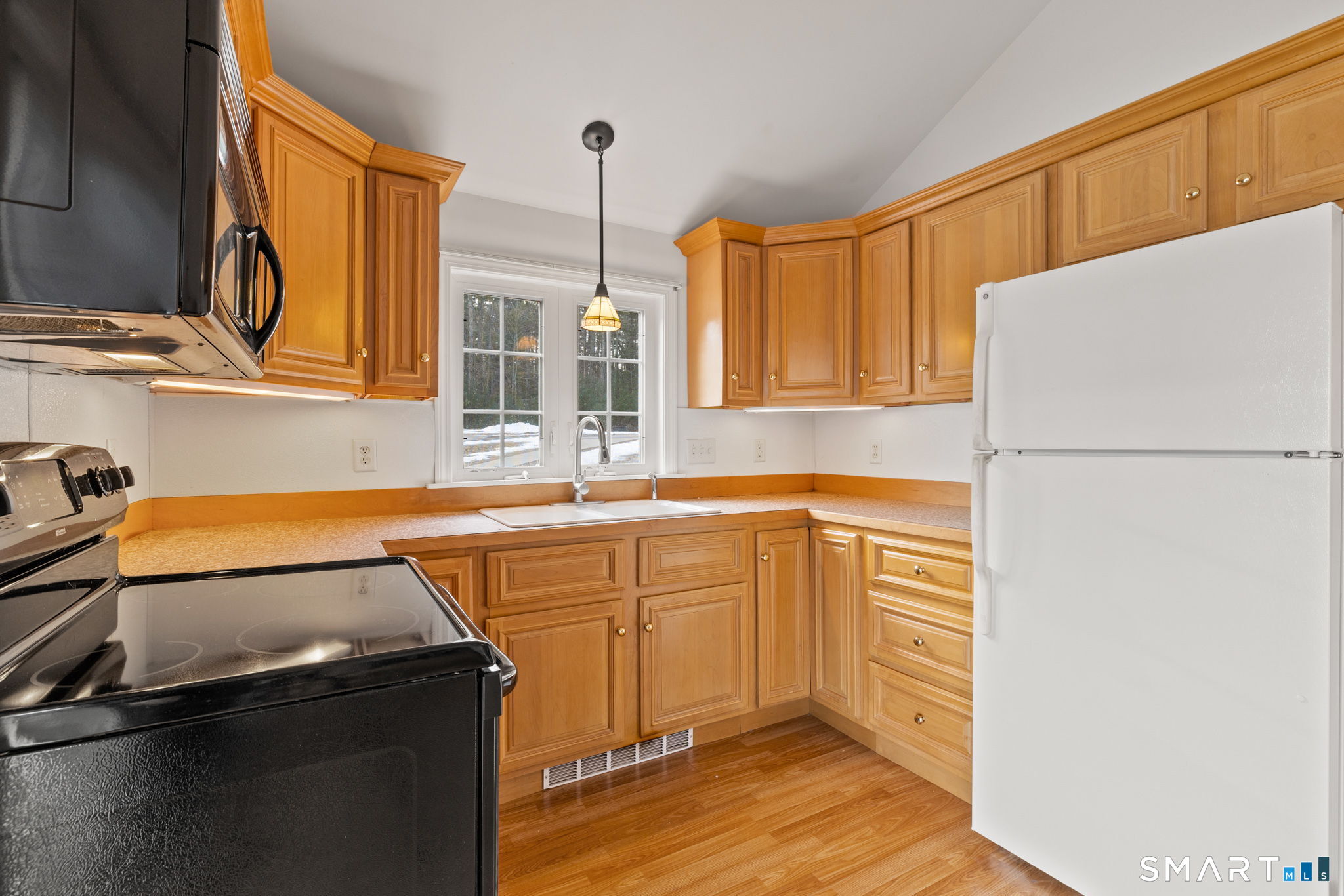 120 Kenwood Road Griswold, CT 06351 - Photo 11 of 34 a kitchen with a sink a stove and a refrigerator