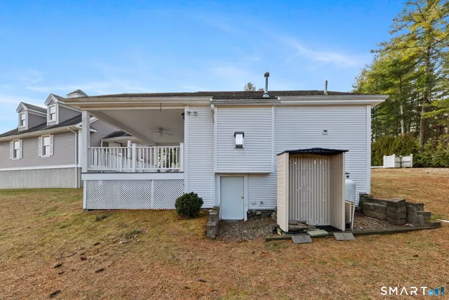 a view of a house with a sink and yard