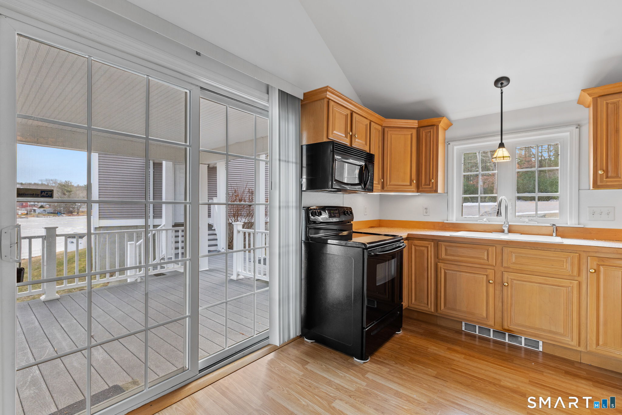 120 Kenwood Road Griswold, CT 06351 - Photo 9 of 34 a kitchen with stainless steel appliances granite countertop a refrigerator a sink and white cabinets