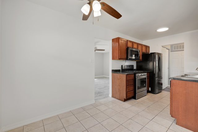 153 North Pinecrest Road Bolingbrook, IL 60440 - Photo 6 of 22 a kitchen with stainless steel appliances a refrigerator and microwave