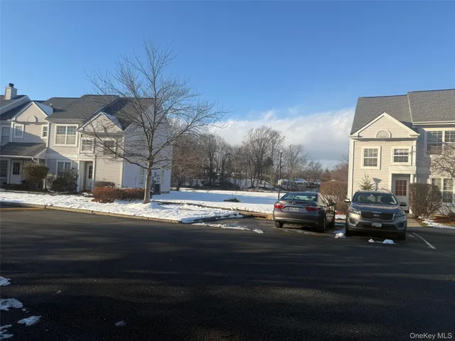 a view of street with parked cars