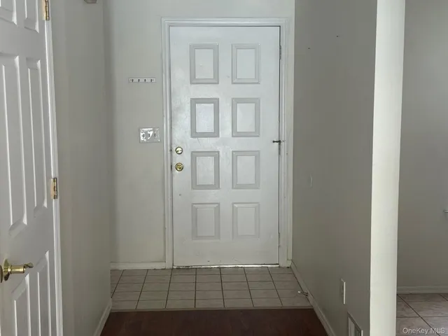 an empty room with wooden floor