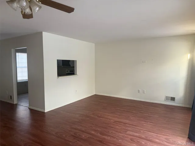 a view of a livingroom with wooden floor