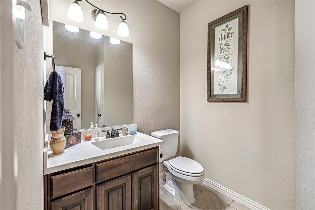 3206 Meadow Ridge Drive Midlothian, TX 76065 - Photo 29 of 37 a bathroom with a sink vanity and a toilet