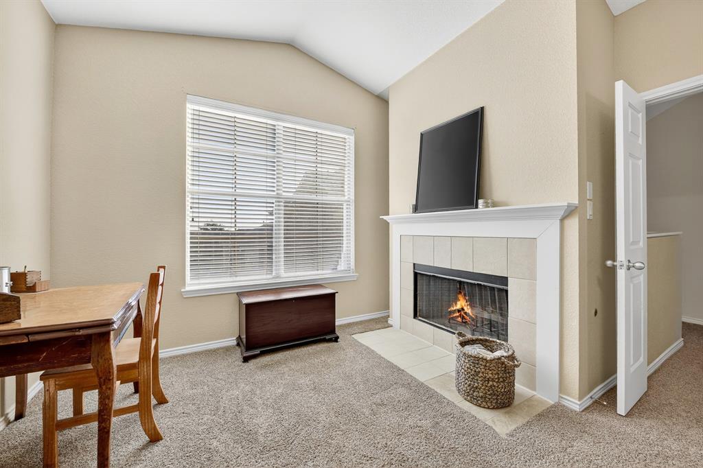 2004 Azure Pointe Richardson, TX 75080 - Photo 16 of 23 a living room with furniture a fireplace and a flat screen tv