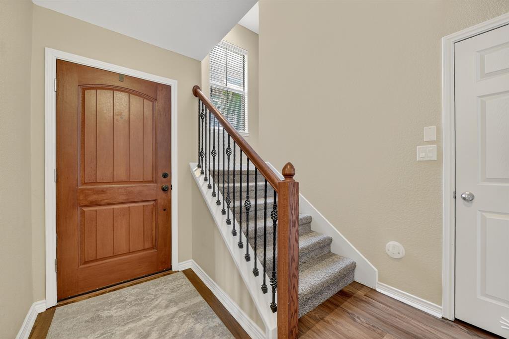 2004 Azure Pointe Richardson, TX 75080 - Photo 4 of 23 a view of an entryway with hardwood