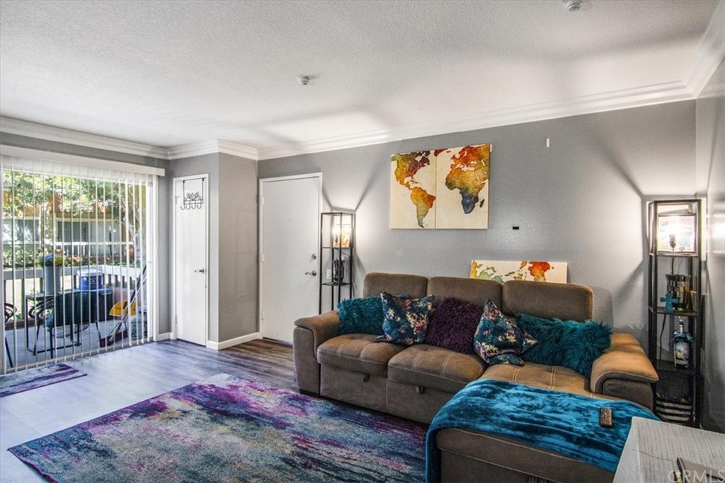 16040 Leffingwell Road, Unit 93 Whittier, CA 90603 - Photo 1 of 1 a living room with furniture and a window