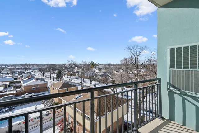 a living room with furniture a fireplace and a table