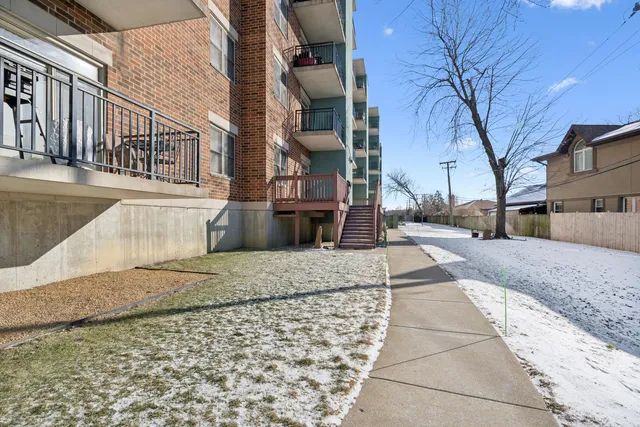 a room with lots of furniture and a book shelf
