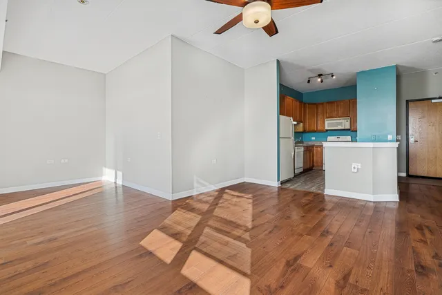 a view of kitchen with furniture and wooden floor