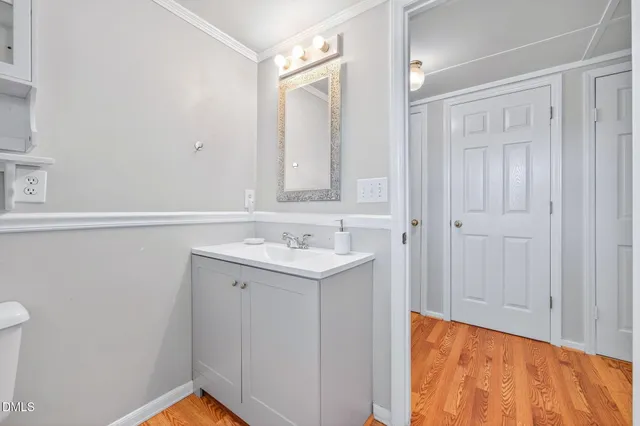 a bathroom with a sink a vanity and a mirror