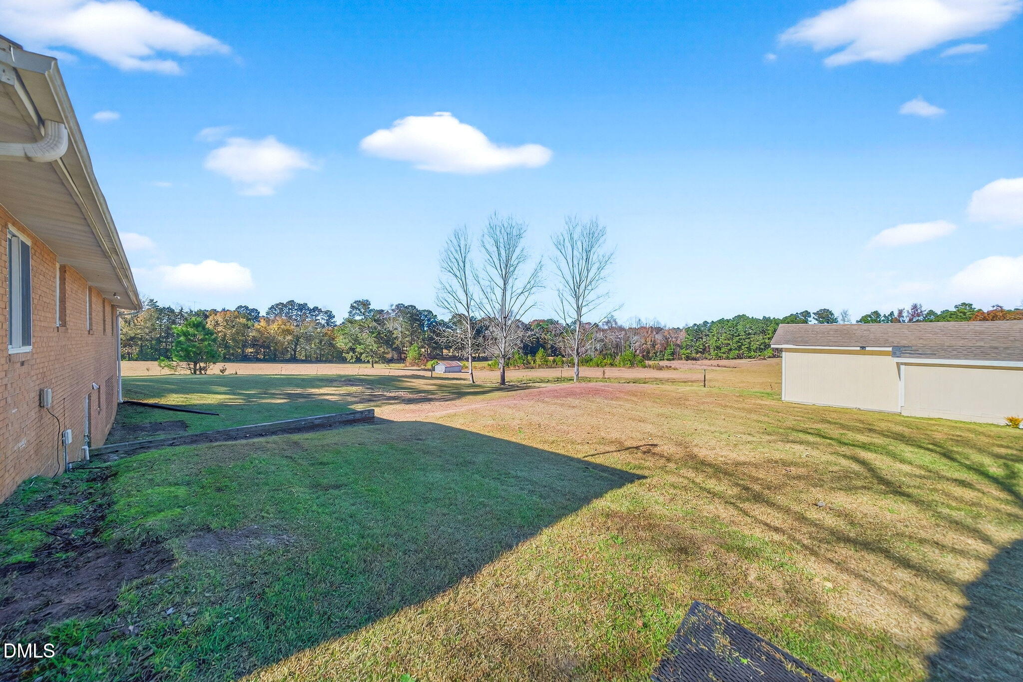 144 Pearidge Road Willow Spring, NC 27592 - Photo 15 of 26 a view of a lake with a yard