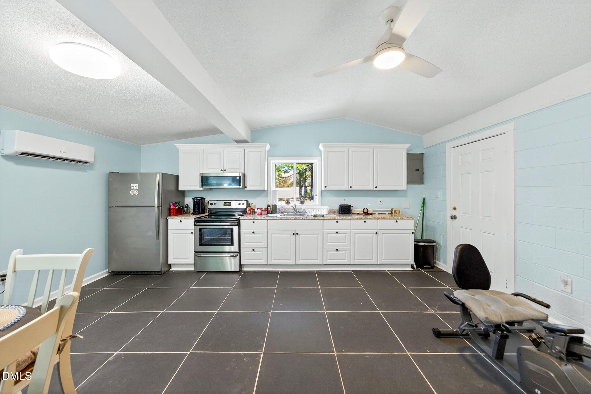 144 Pearidge Road Willow Spring, NC 27592 - Photo 18 of 26 a large white kitchen with cabinets and stainless steel appliances