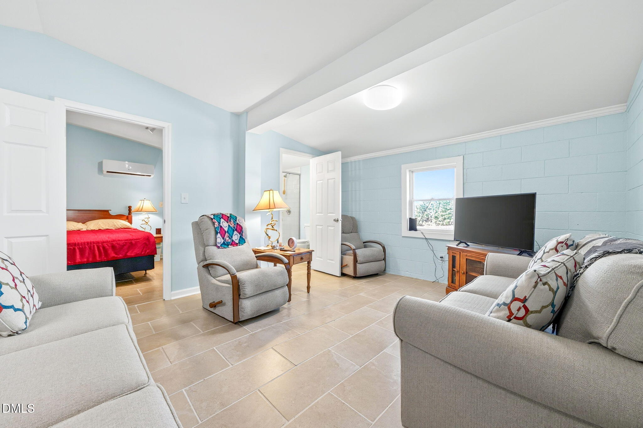 144 Pearidge Road Willow Spring, NC 27592 - Photo 20 of 26 a living room with furniture and a flat screen tv