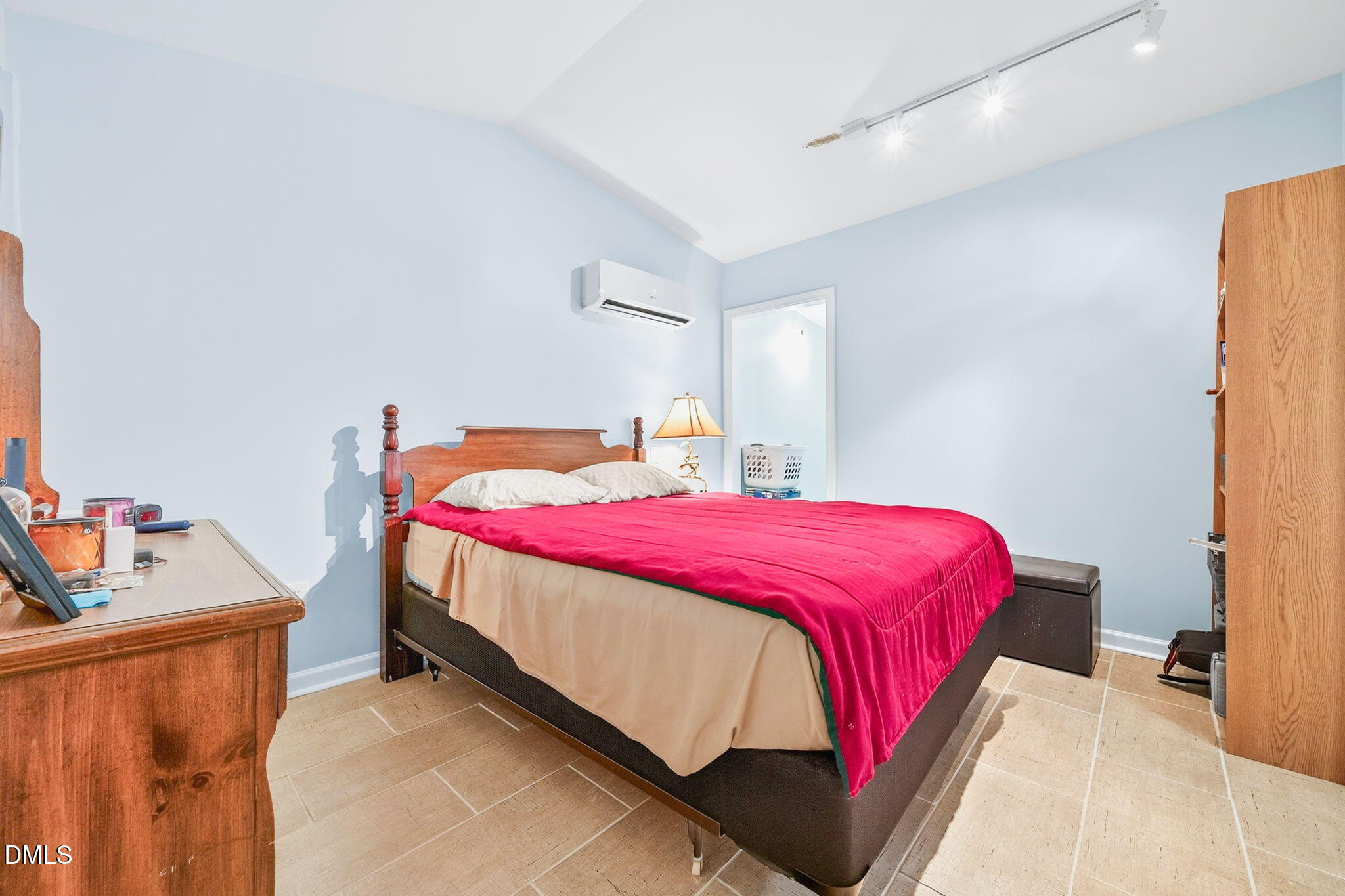 144 Pearidge Road Willow Spring, NC 27592 - Photo 22 of 26 a bedroom with a bed and a dresser