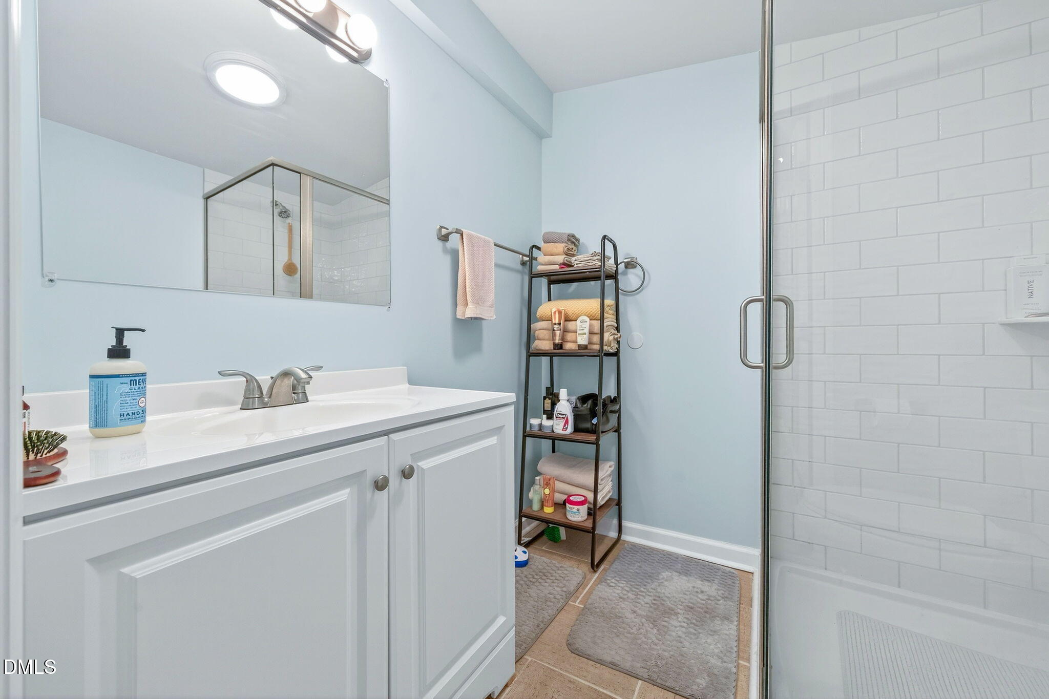 144 Pearidge Road Willow Spring, NC 27592 - Photo 23 of 26 a utility room with cabinets washer and dryer