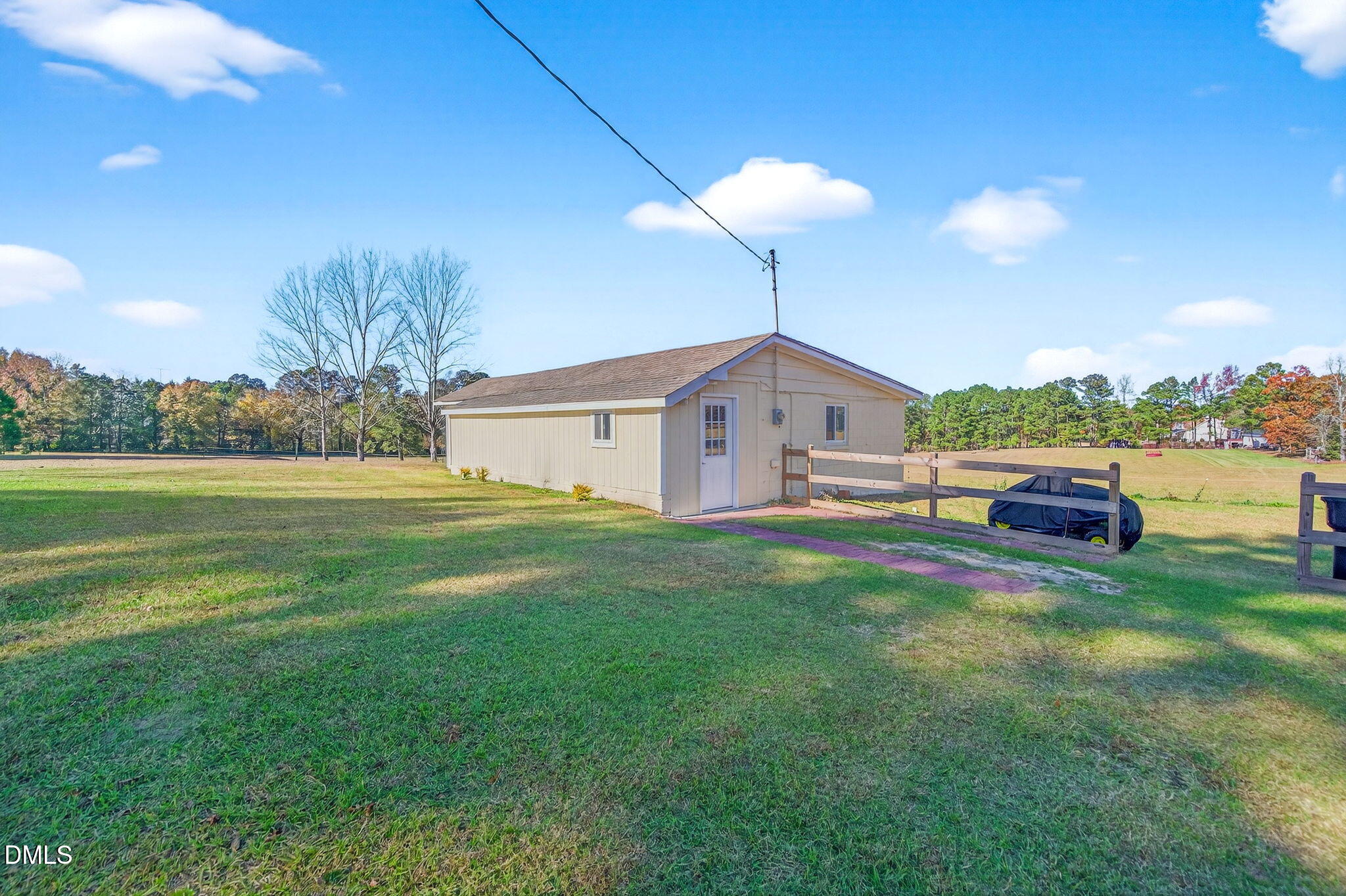 144 Pearidge Road Willow Spring, NC 27592 - Photo 25 of 26 a front view of a house with garden