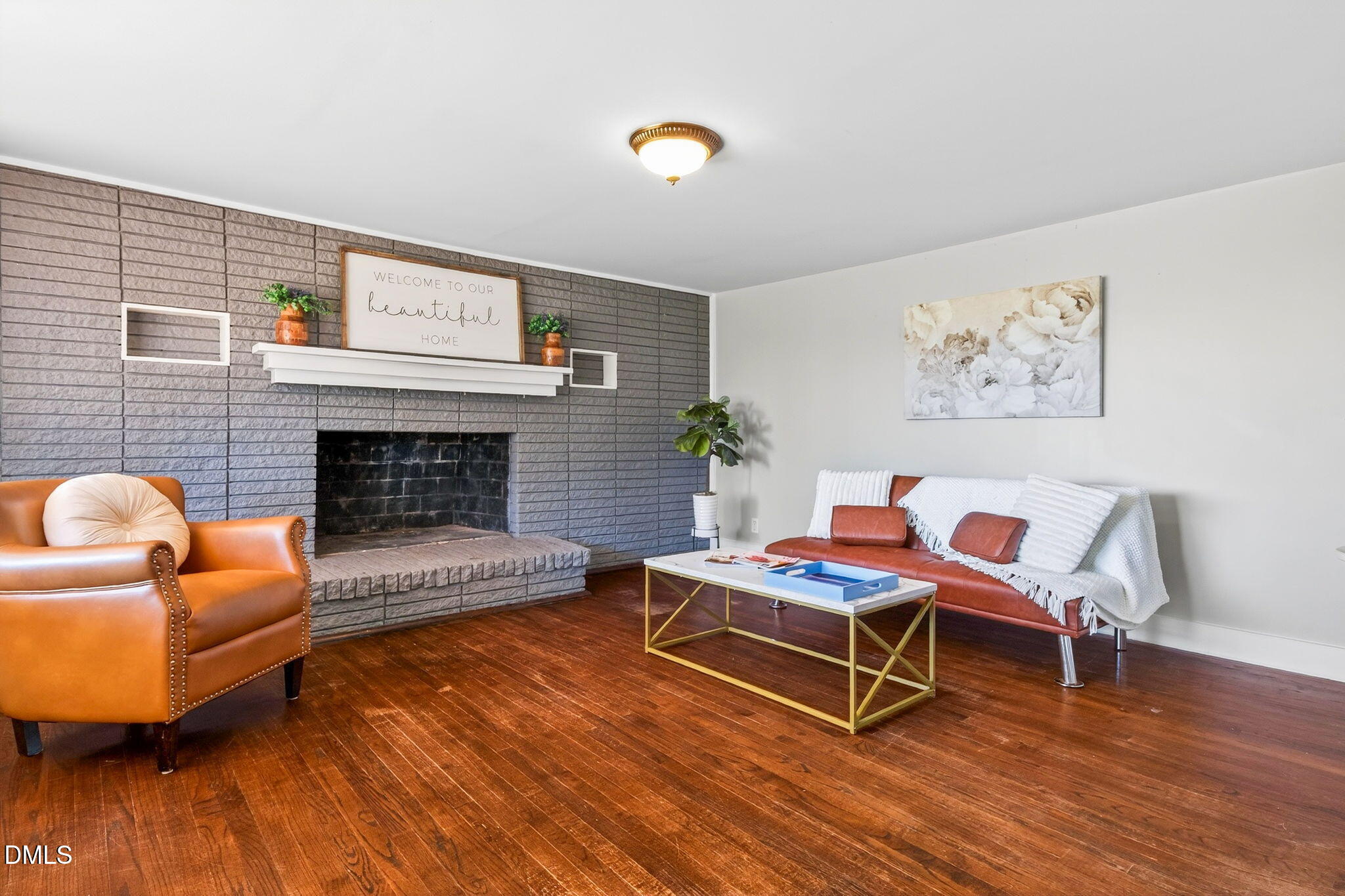 144 Pearidge Road Willow Spring, NC 27592 - Photo 3 of 26 a living room with furniture and a fireplace
