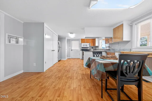 a open kitchen with stainless steel appliances granite countertop a sink and a refrigerator