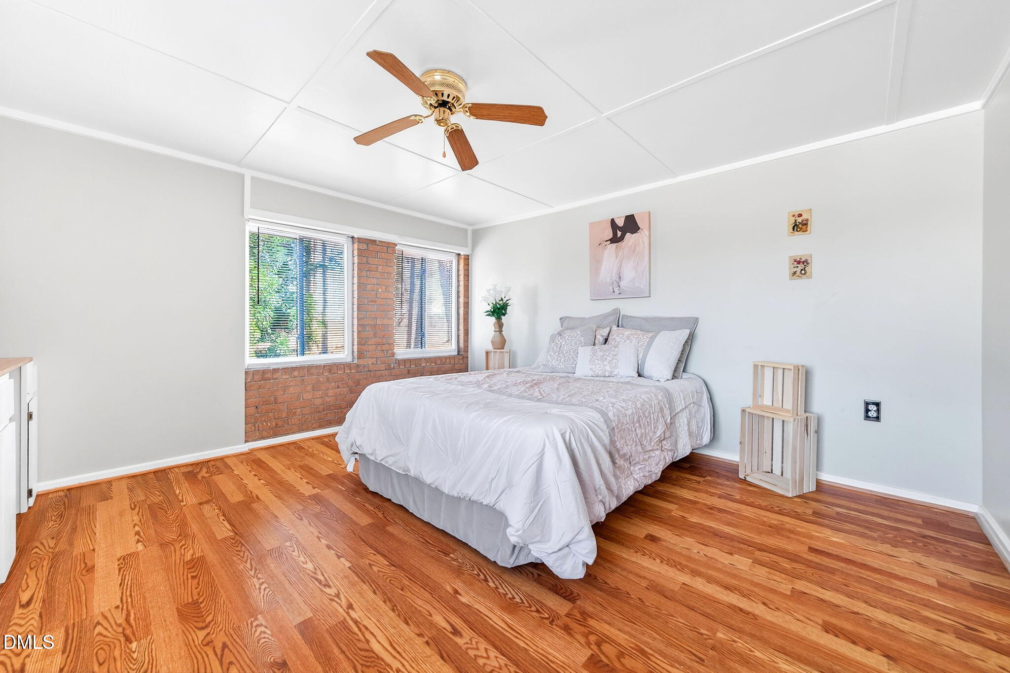 144 Pearidge Road Willow Spring, NC 27592 - Photo 7 of 26 a bedroom with a bed and wooden floor