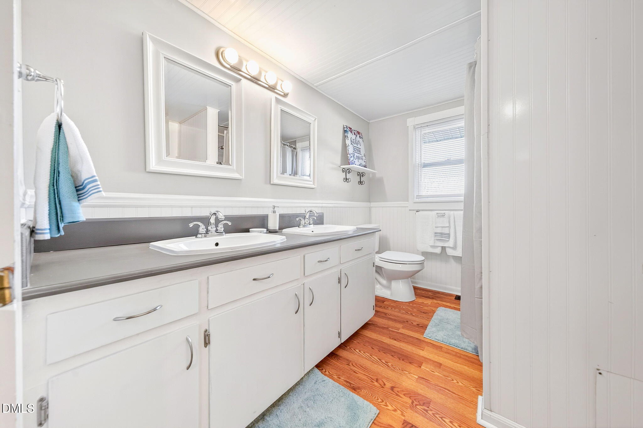 144 Pearidge Road Willow Spring, NC 27592 - Photo 8 of 26 a spacious bathroom with a double vanity sink mirror and toilet