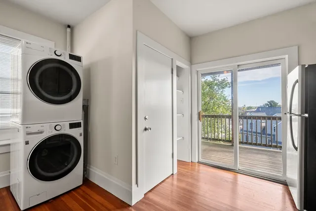 a view of a hallway with washer and dryer