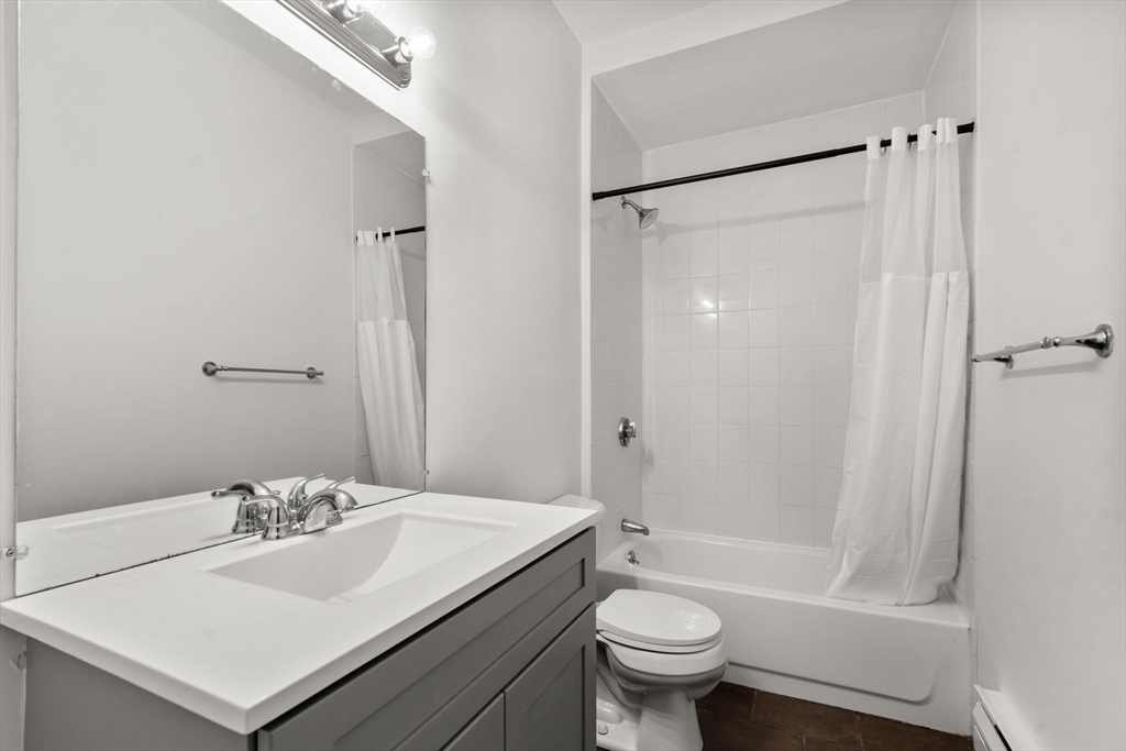 27 Buttonwood Street Boston, MA 02125 - Photo 7 of 12 a bathroom with a sink toilet and shower