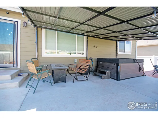 a living room with furniture and a piano