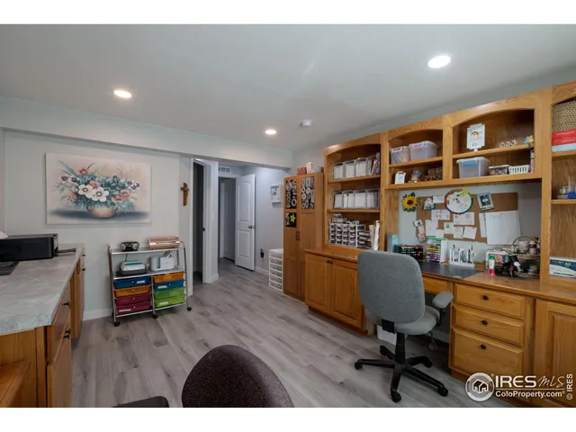 a workspace with furniture and wooden floor