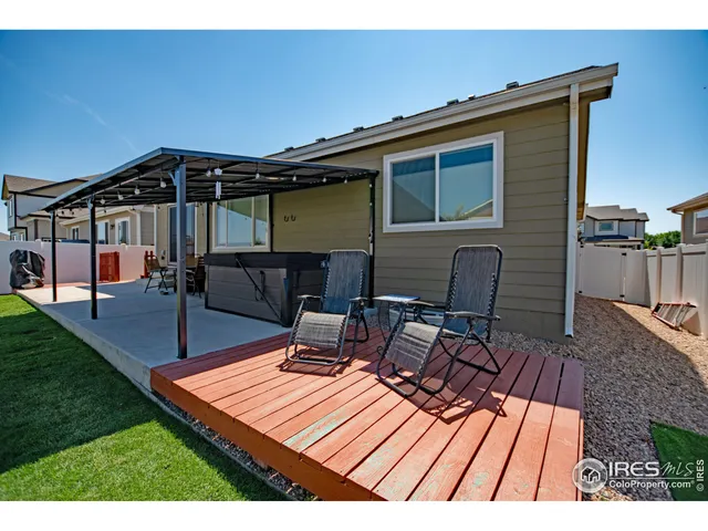 a wooden bench sitting on top of a wooden deck