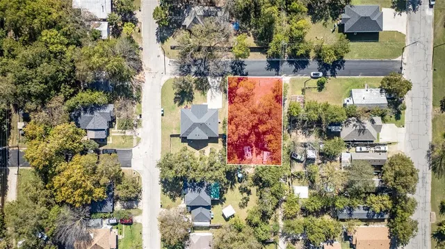 an aerial view of residential house with outdoor space and street view