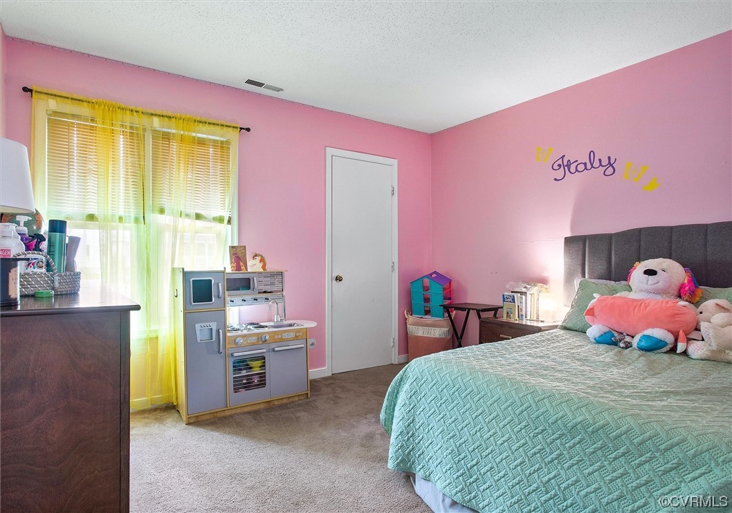 4933 Gention Road Chesterfield, VA 23832 - Photo 17 of 24 a bedroom with a bed and dresser