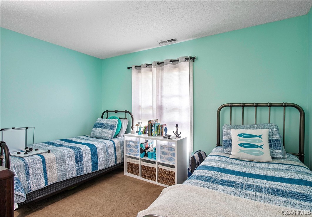 4933 Gention Road Chesterfield, VA 23832 - Photo 18 of 24 a bedroom with a bed and window