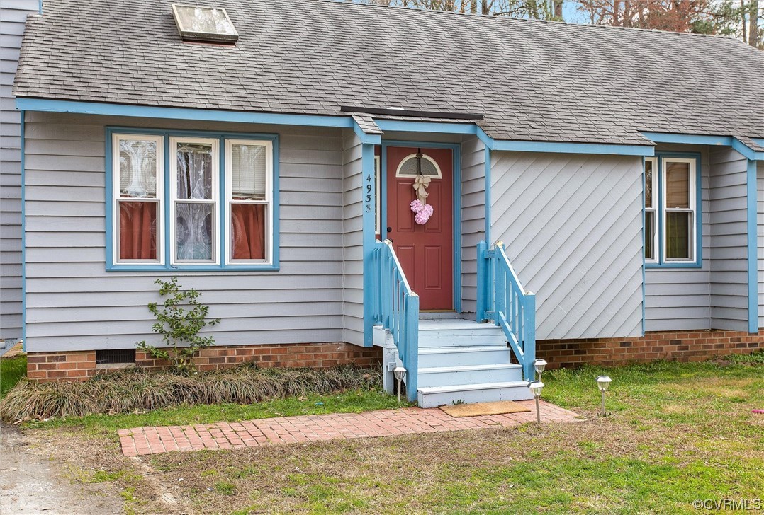 4933 Gention Road Chesterfield, VA 23832 - Photo 3 of 24 a front view of a house with a yard