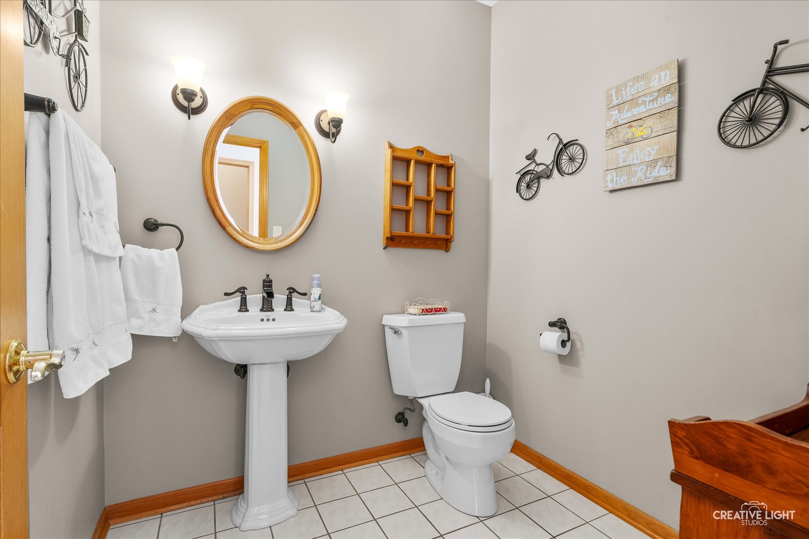 1651 Johnson Road Oswego, IL 60543 - Photo 18 of 60 a bathroom with a sink and a mirror
