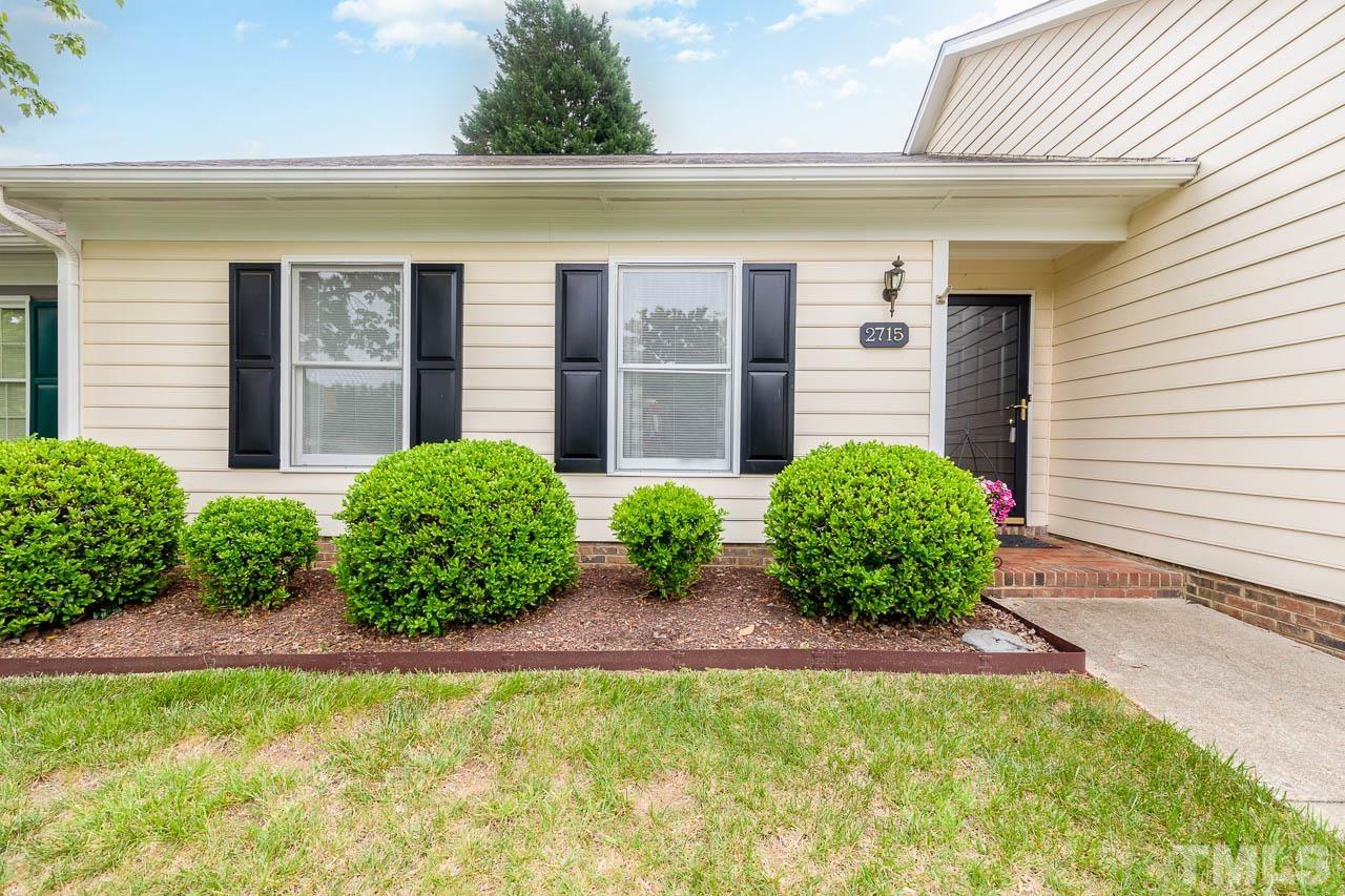 2715 Cottage Circle Raleigh, NC 27613 - Photo 3 of 26 a view of a garden with potted plants