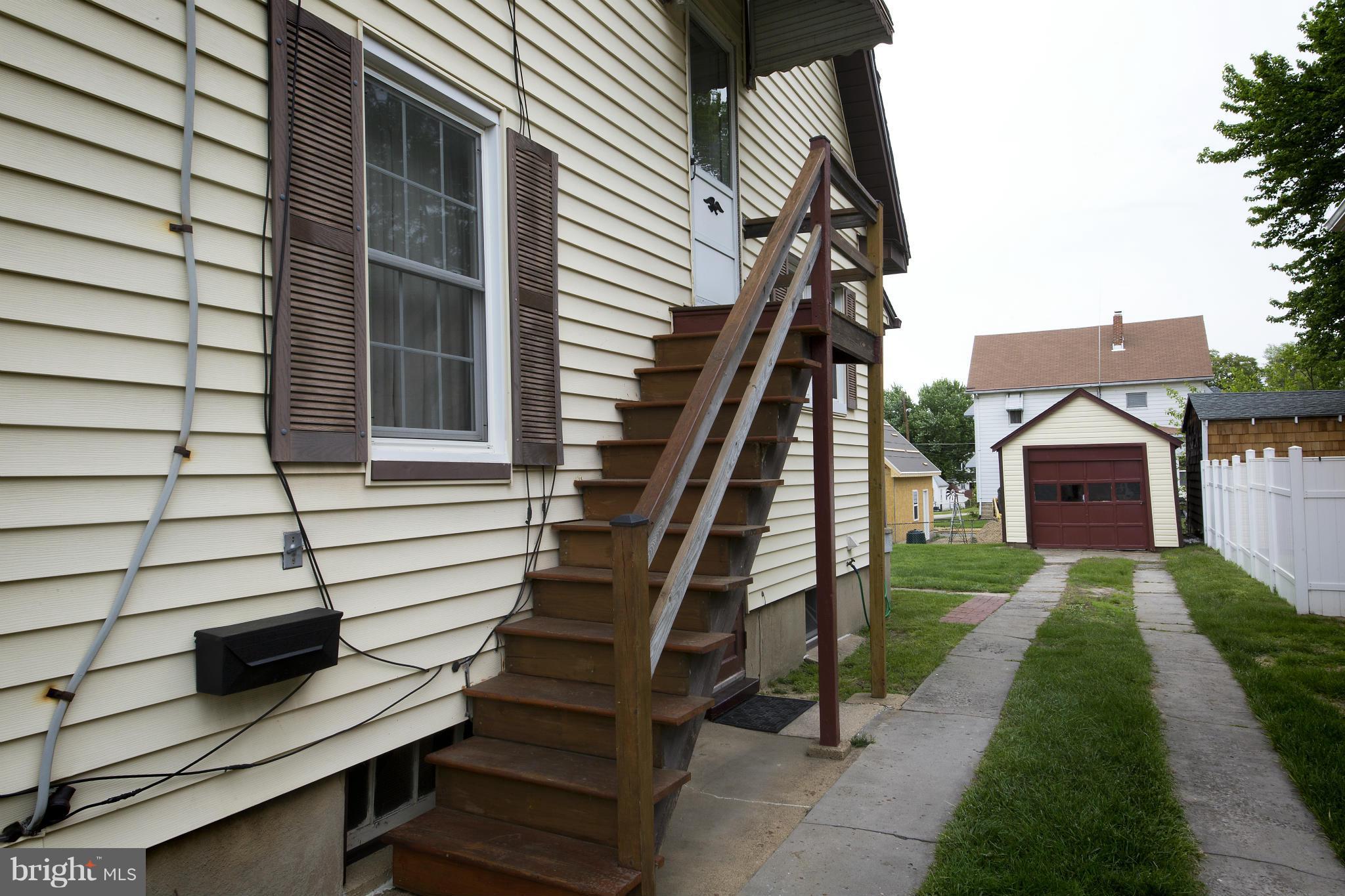 4502 Ridge Avenue Halethorpe, MD 21227 - Photo 22 of 24 a view of front door of house with stairs
