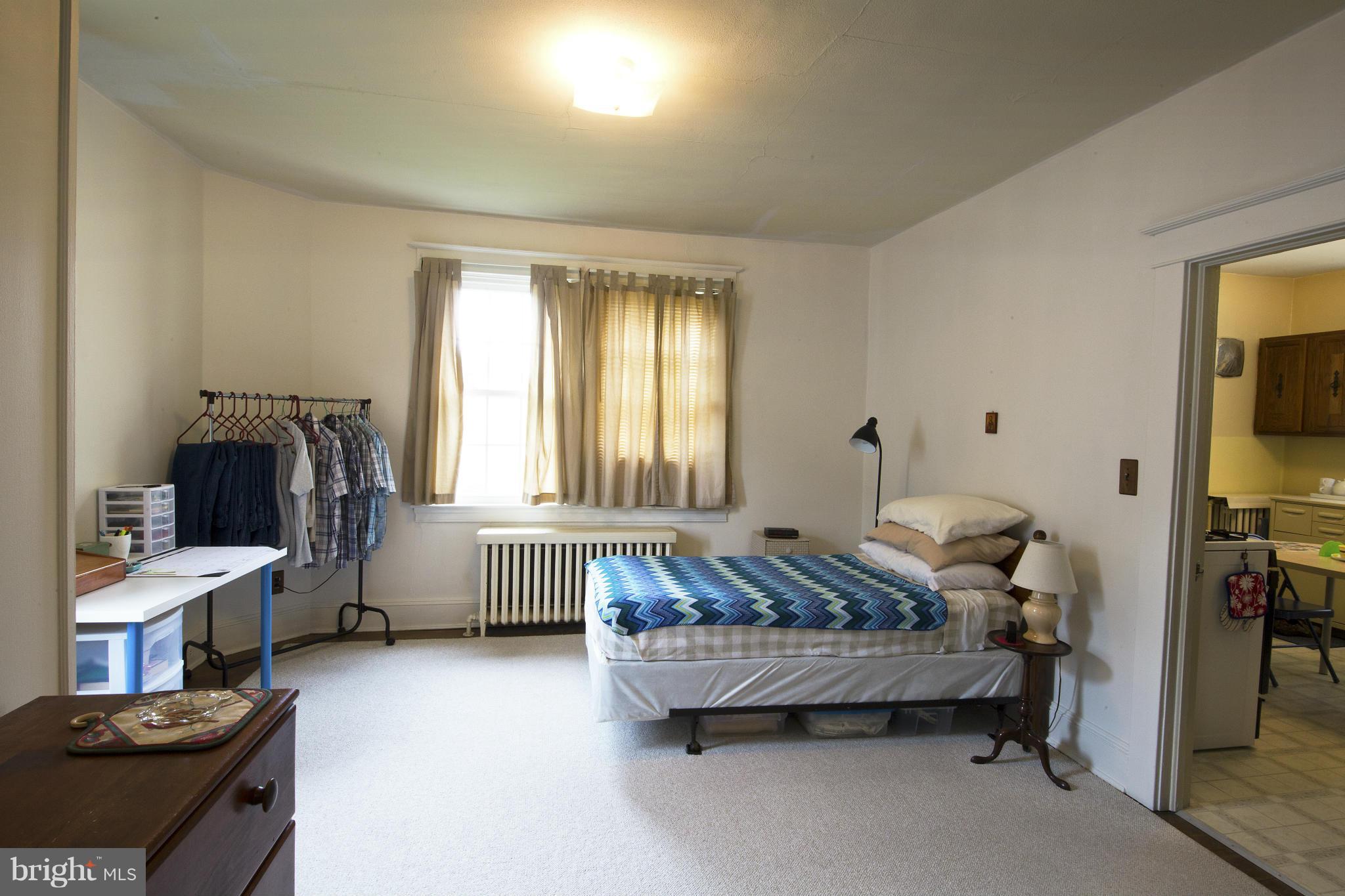 4502 Ridge Avenue Halethorpe, MD 21227 - Photo 7 of 24 a bedroom with furniture and a window