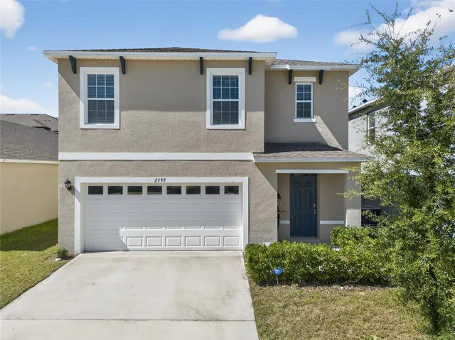 front view of a house with a yard