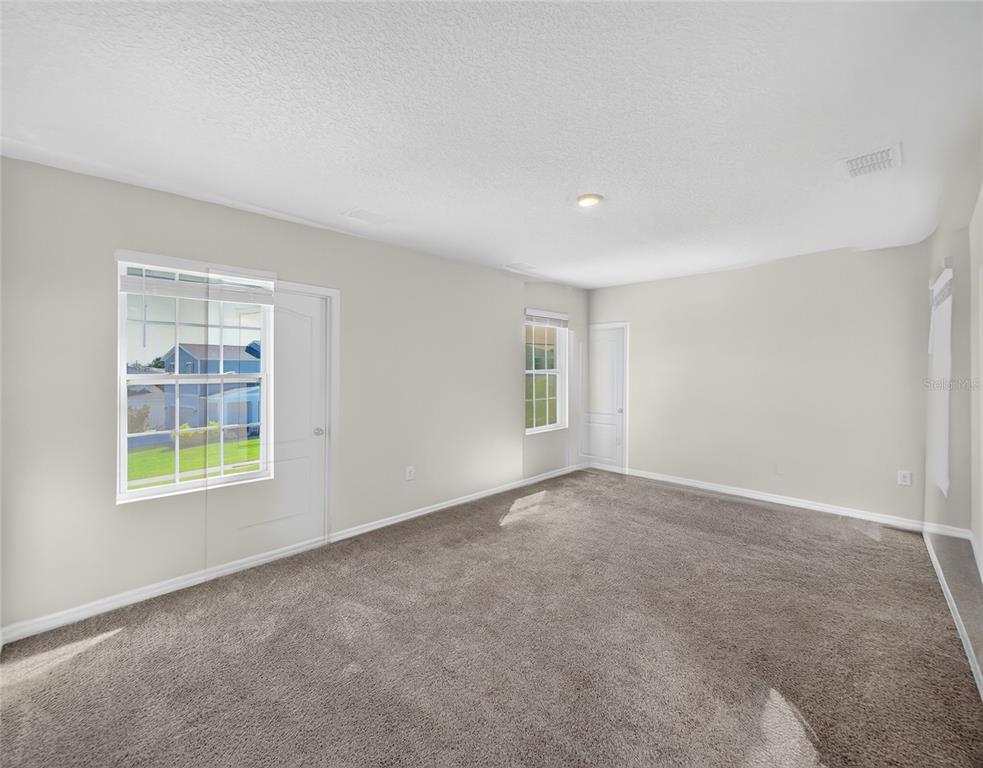 2597 Shamrock Street Tavares, FL 32778 - Photo 27 of 57 an empty room with windows