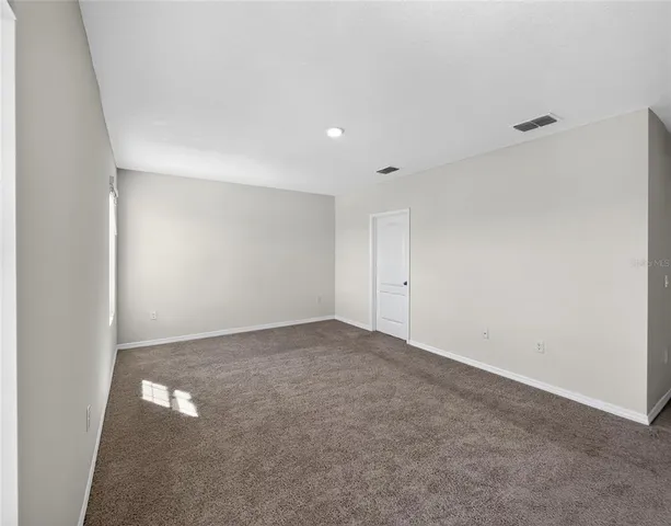 a view of a kitchen with a sink and a window