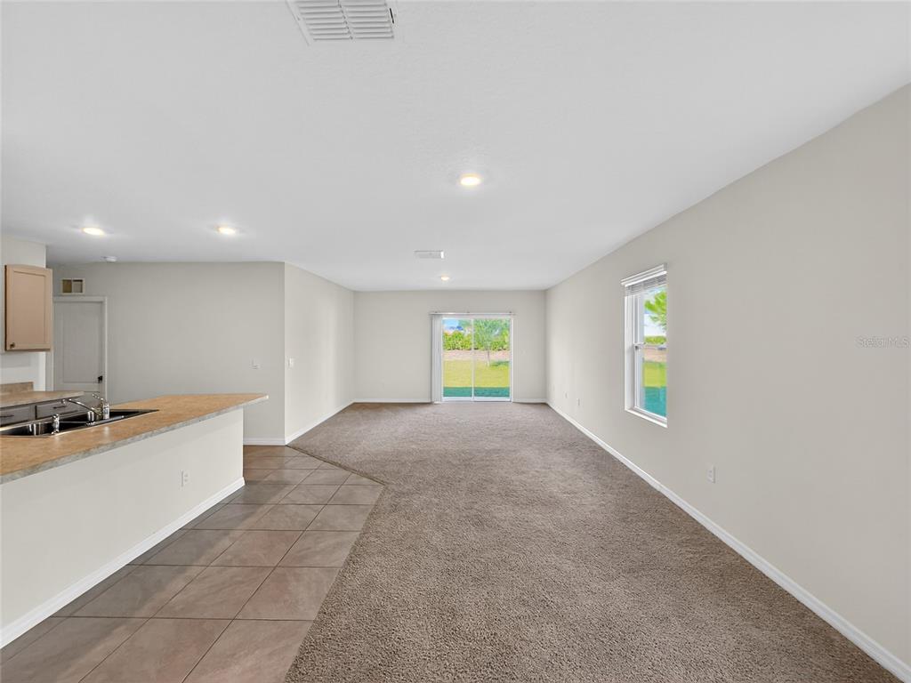 2597 Shamrock Street Tavares, FL 32778 - Photo 33 of 57 a view of a kitchen with a sink and a window