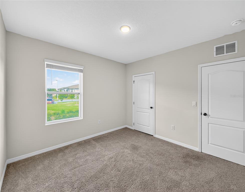 2597 Shamrock Street Tavares, FL 32778 - Photo 35 of 57 a view of an empty room with a window