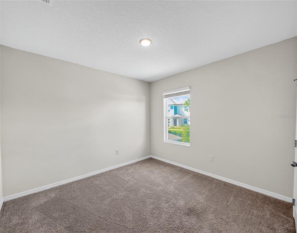 2597 Shamrock Street Tavares, FL 32778 - Photo 37 of 57 an empty room with windows