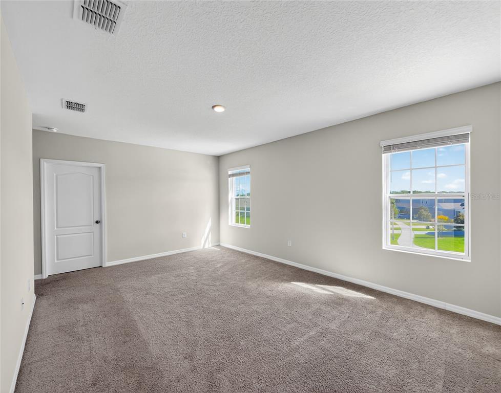 2597 Shamrock Street Tavares, FL 32778 - Photo 38 of 57 an empty room with windows