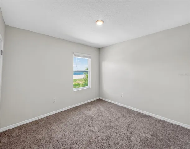 a bathroom with a granite countertop sink toilet a shower and a mirror