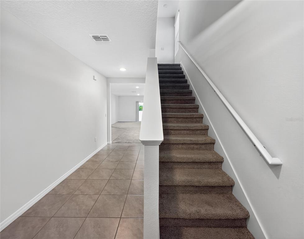 2597 Shamrock Street Tavares, FL 32778 - Photo 40 of 57 a view of entryway and hall
