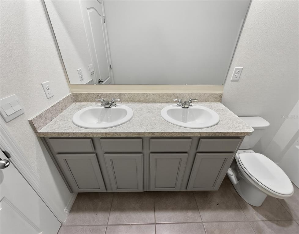 2597 Shamrock Street Tavares, FL 32778 - Photo 41 of 57 a bathroom with a sink and a toilet