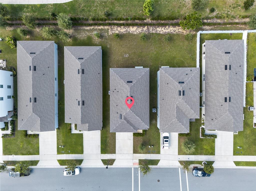 2597 Shamrock Street Tavares, FL 32778 - Photo 50 of 57 an aerial view of residential house with outdoor space and lake view