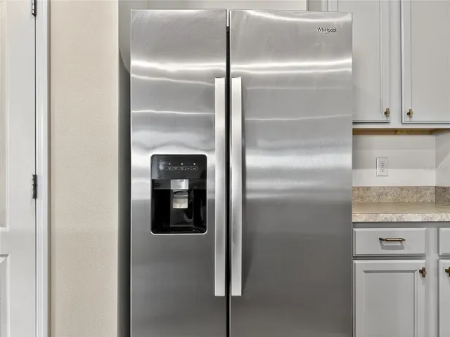a close view of a refrigerator in kitchen counter top